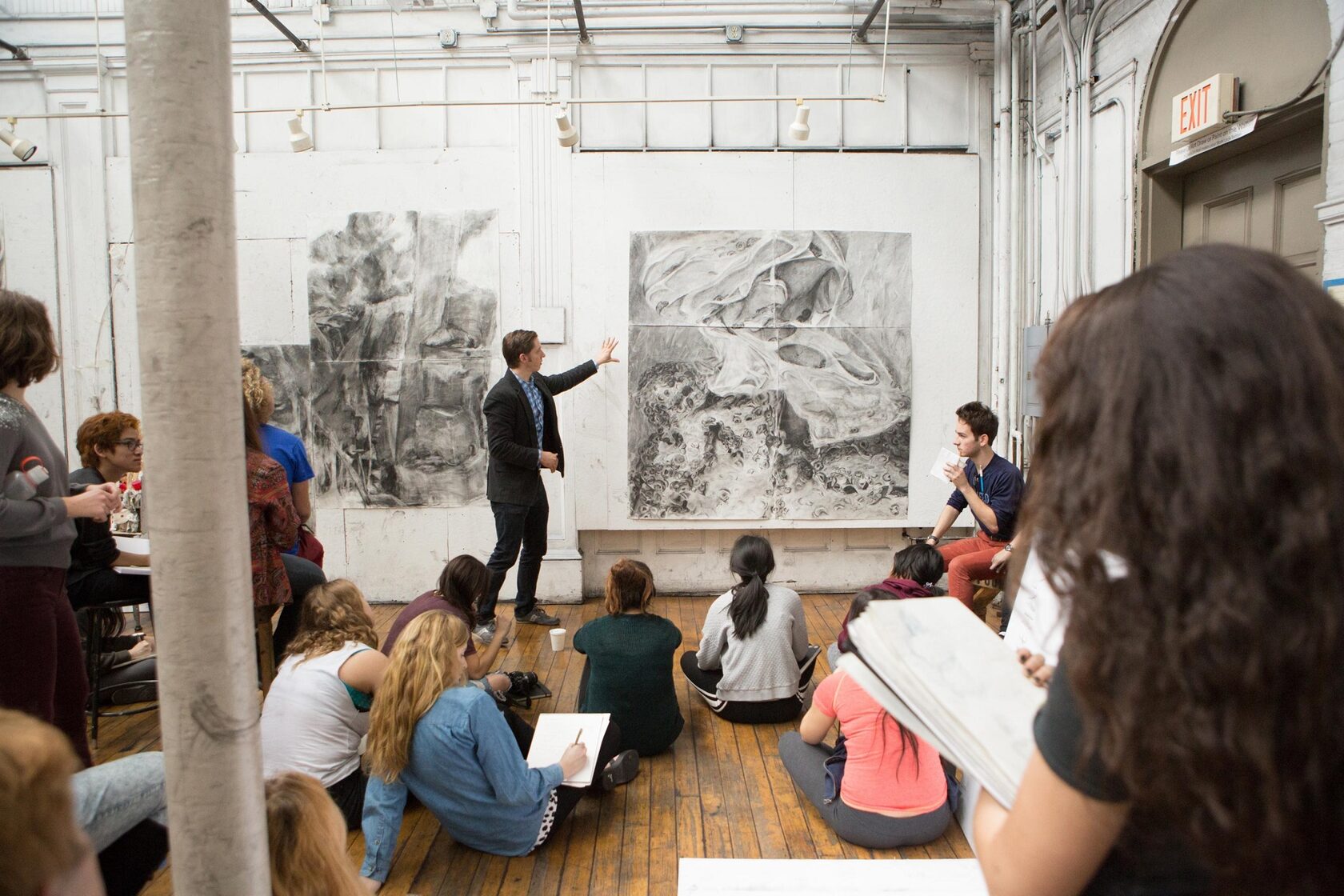 Collectors discovering emerging artists at an art school degree show