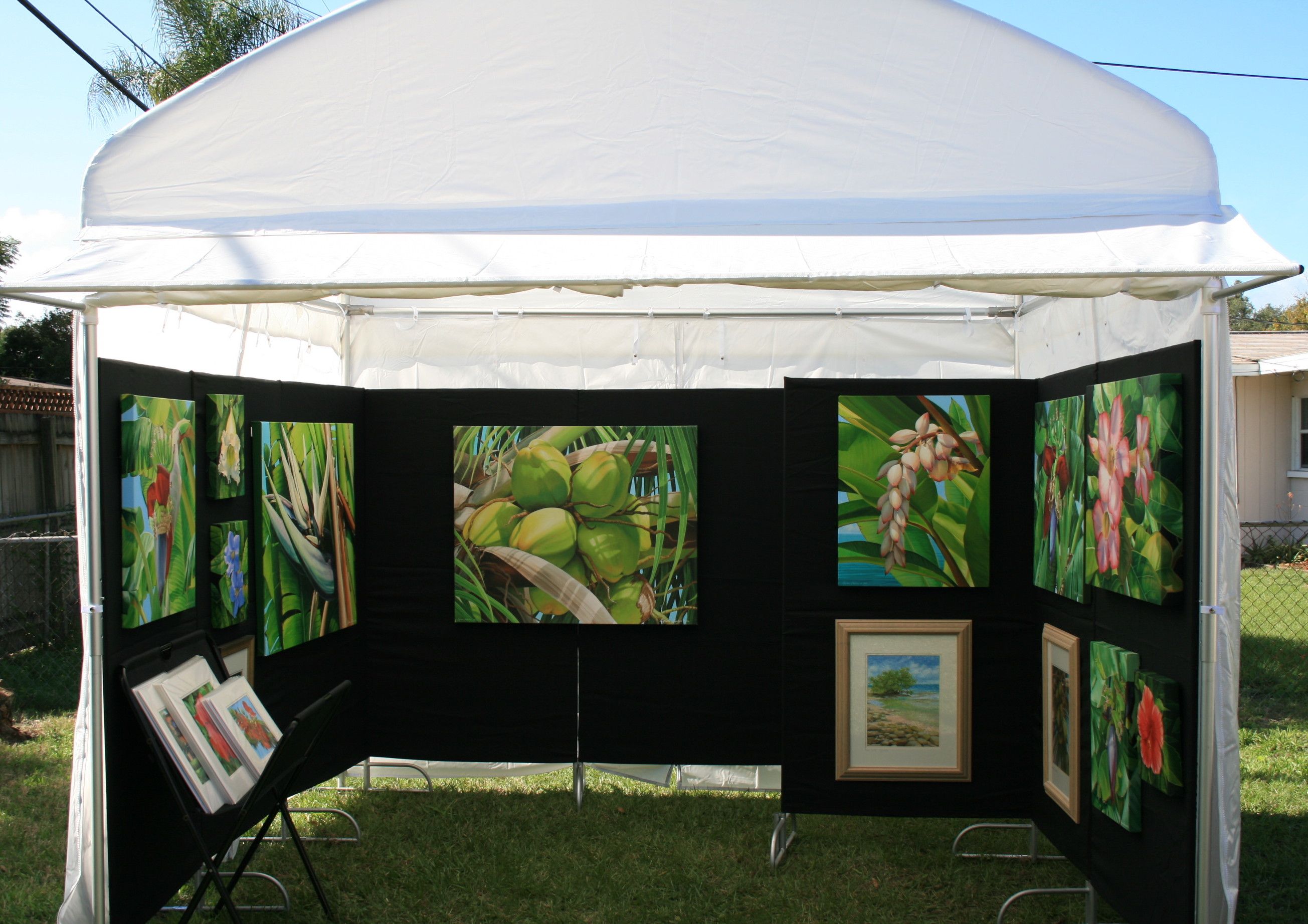 Artworks available in the back room of a gallery booth