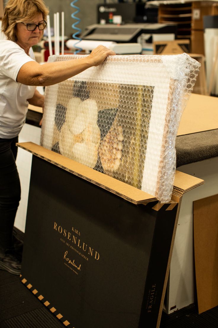 Gallery professionally packing artwork for a collector