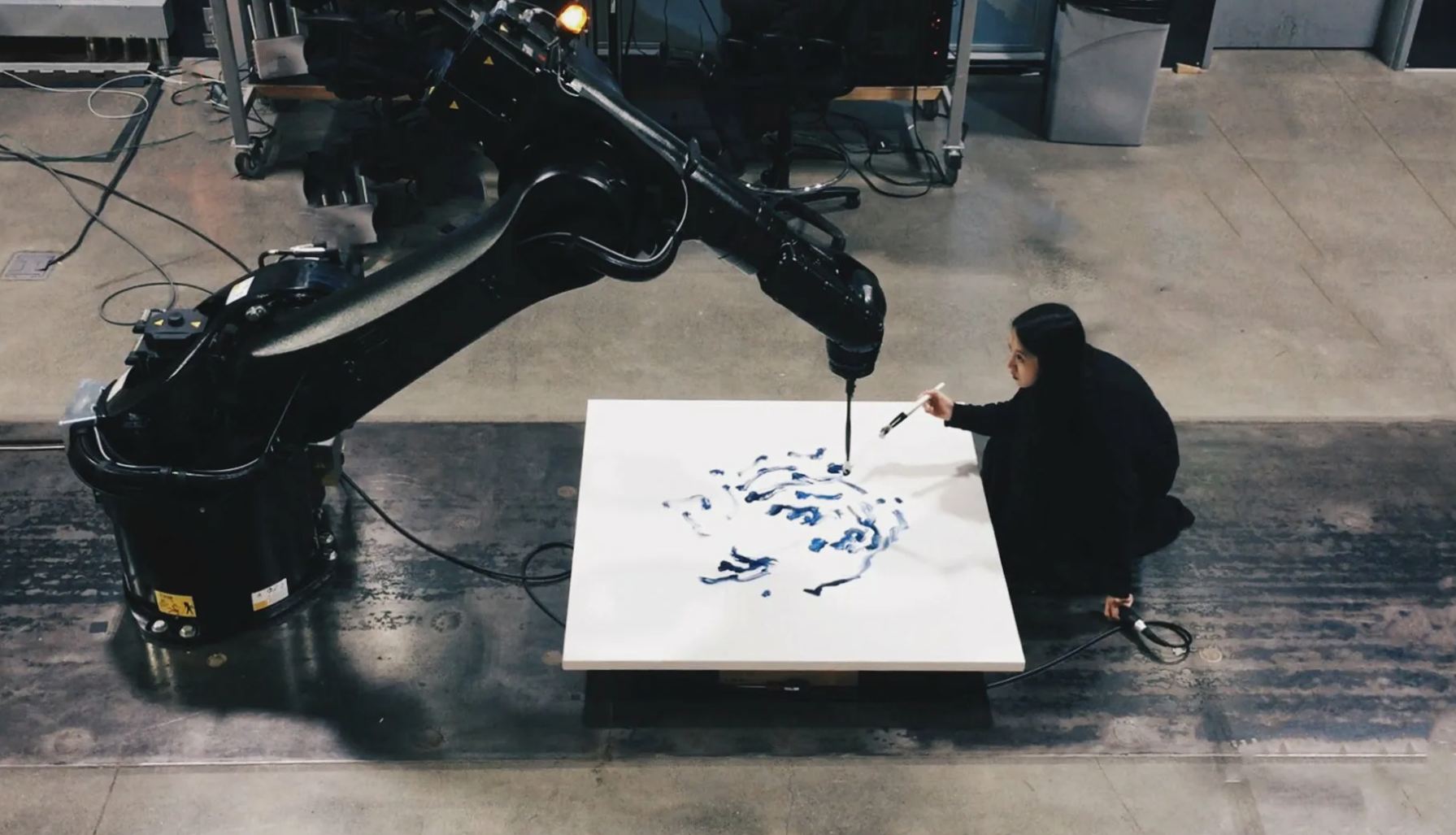 Sougwen Chung creating art with artificial intelligence and robots