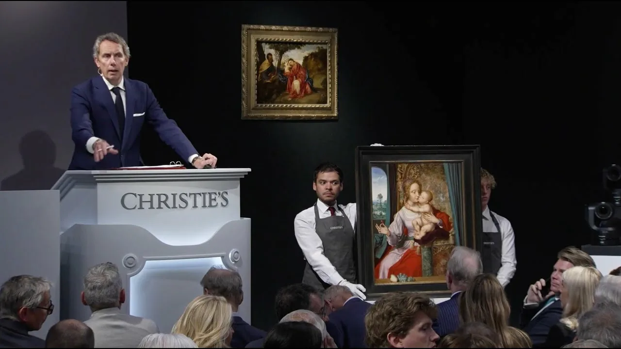 Collector placing an online bid at Christie’s auction