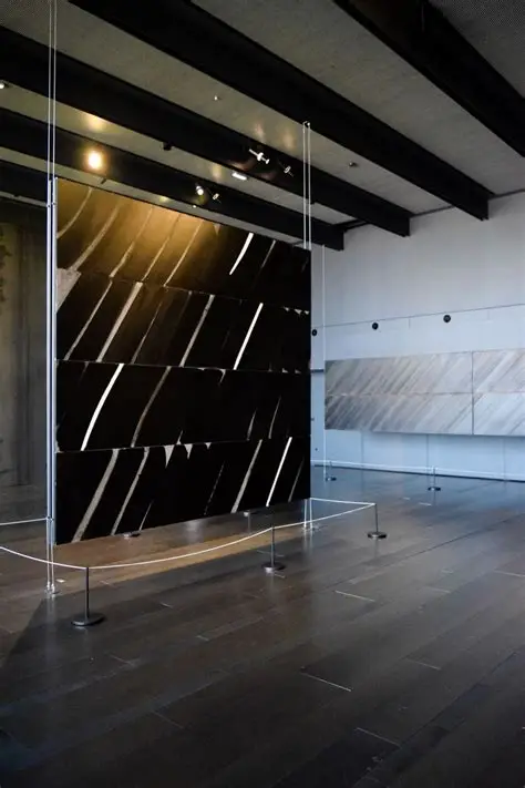Pierre Soulages Outrenoir black painting reflecting natural light